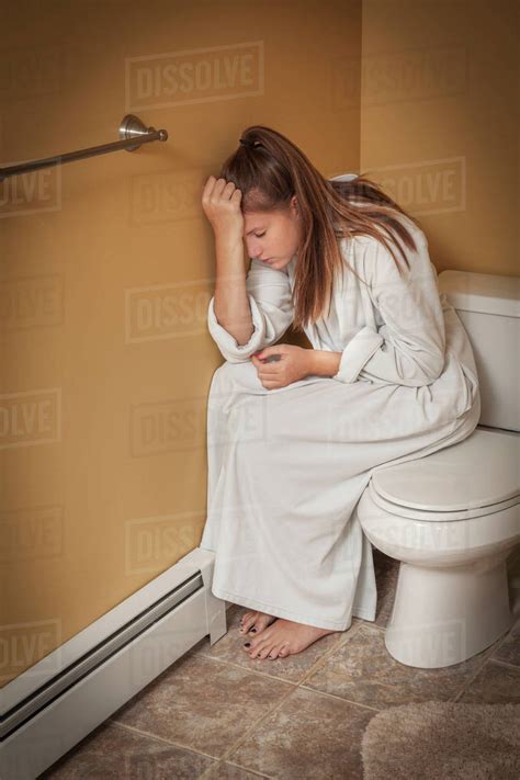 Stock Video ID: 26807341 Woman <b>Sitting</b> On <b>Toilet</b> In Bathroom Young Girl Beautiful Smiling In Restroom Important information Release information: Signed model release on file with Shutterstock, Inc. . Teen girls sitting on the toilet